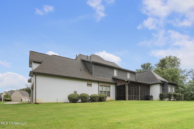 123 Klaas Blvd, Madison, MS 39110 - back of property with a yard, a sunroom, a shingled roof, and brick siding