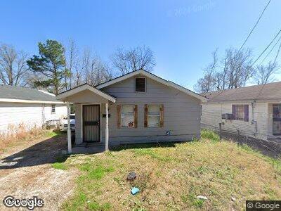 2214 Prosperity St, Jackson, MS 39213 - view of front facade featuring a front lawn and fence