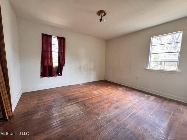 341 Savanna St, Jackson, MS 39212 - unfurnished room featuring baseboards, a healthy amount of sunlight, and wood-type flooring