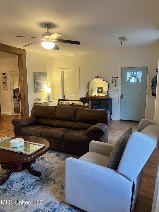 1006 Lamar St, Cleveland, MS 38732 - living area featuring wood finished floors, a ceiling fan, and baseboards