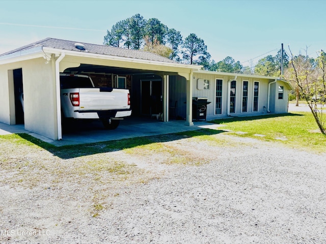ranch-style home featuring a carport