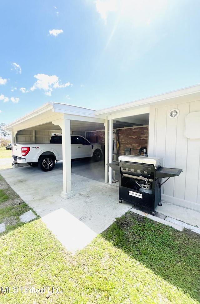 view of parking / parking lot featuring an attached carport