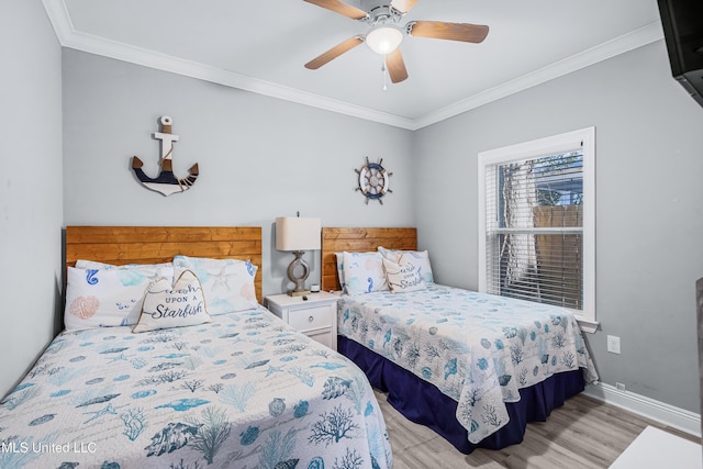 bedroom featuring crown molding, light wood-type flooring, and ceiling fan