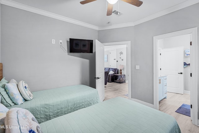 bedroom with ornamental molding, ceiling fan, and light hardwood / wood-style floors