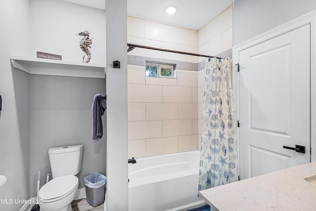 full bathroom with shower / tub combo with curtain, vanity, and toilet