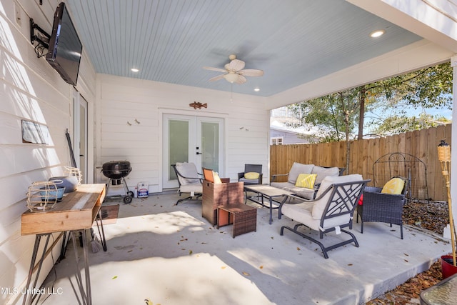 view of patio with an outdoor living space, a grill, ceiling fan, and french doors