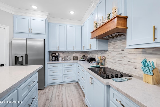 kitchen with stainless steel refrigerator with ice dispenser, ornamental molding, black electric cooktop, and white cabinets