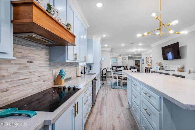 kitchen with decorative light fixtures, white cabinets, black electric stovetop, crown molding, and custom range hood