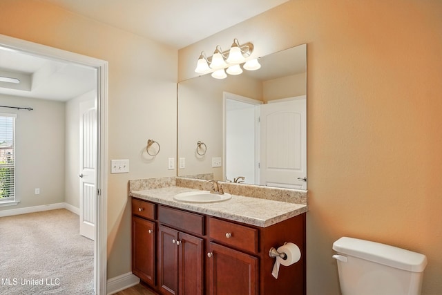 14540 Canal Loop, Gulfport, MS 39503 - bathroom with vanity, toilet, and baseboards