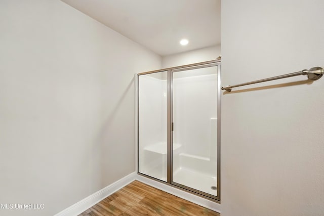 14540 Canal Loop, Gulfport, MS 39503 - bathroom featuring a shower stall, wood finished floors, and baseboards