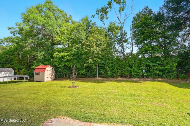 14540 Canal Loop, Gulfport, MS 39503 - view of green lawn with a storage unit and an outbuilding