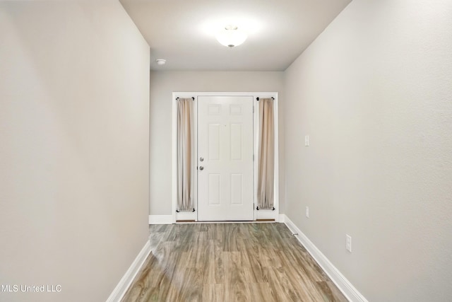 14540 Canal Loop, Gulfport, MS 39503 - doorway to outside featuring baseboards and light wood-type flooring
