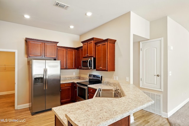 14540 Canal Loop, Gulfport, MS 39503 - kitchen featuring stainless steel appliances, a sink, a peninsula, light countertops, and recessed lighting