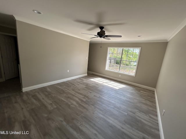 215 Quail Trl, Greenwood, MS 38930 - spare room featuring baseboards, ornamental molding, dark wood-style floors, a ceiling fan, and recessed lighting
