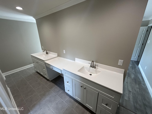 215 Quail Trl, Greenwood, MS 38930 - bathroom featuring crown molding, vanity, baseboards, recessed lighting, and tile patterned floors