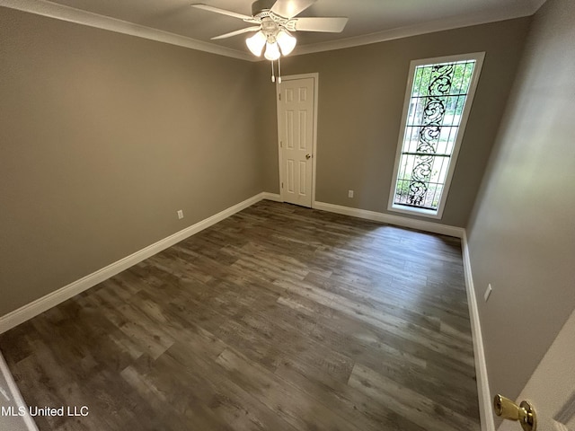 215 Quail Trl, Greenwood, MS 38930 - unfurnished room with crown molding, dark wood-style flooring, a ceiling fan, and baseboards