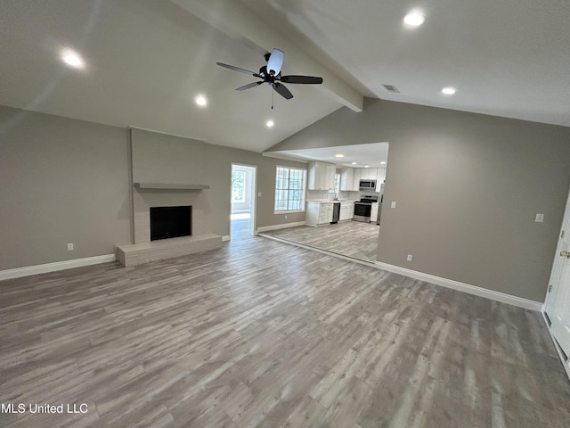 215 Quail Trl, Greenwood, MS 38930 - unfurnished living room featuring a fireplace, baseboards, a ceiling fan, light wood finished floors, and recessed lighting