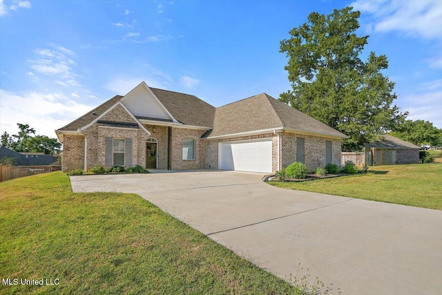 view of front facade with a front lawn and a garage