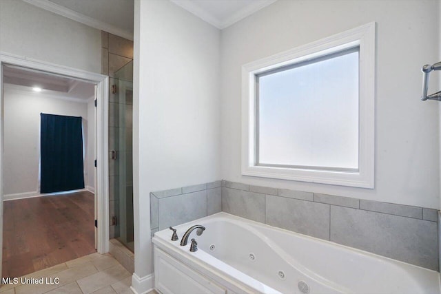 bathroom with crown molding, independent shower and bath, and hardwood / wood-style floors