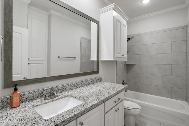 full bathroom featuring vanity, toilet, ornamental molding, and tiled shower / bath