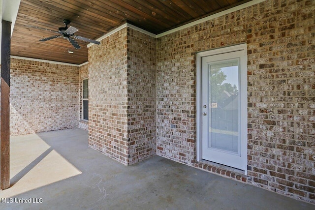 entrance to property featuring ceiling fan