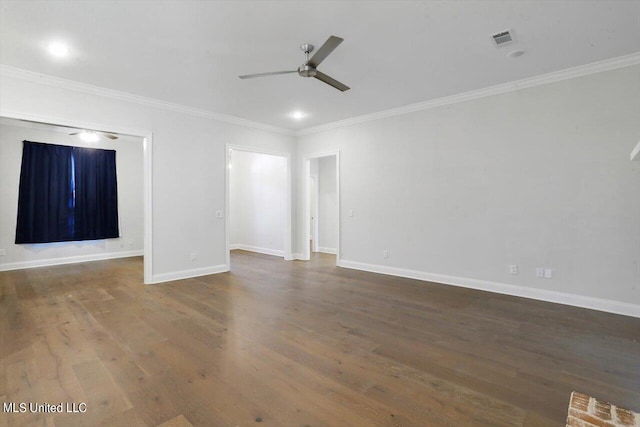 spare room featuring dark wood-type flooring, crown molding, and ceiling fan