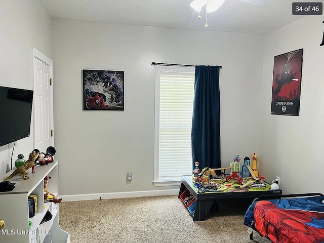 carpeted bedroom featuring ceiling fan