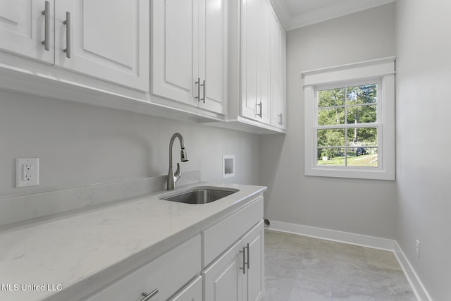 111 Grand Oak Blvd, Clinton, MS 39056 - laundry room featuring cabinet space, washer hookup, baseboards, light marble finish floors, and ornamental molding