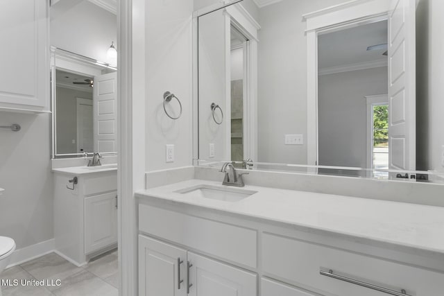 111 Grand Oak Blvd, Clinton, MS 39056 - bathroom featuring ornamental molding, vanity, toilet, baseboards, and ceiling fan