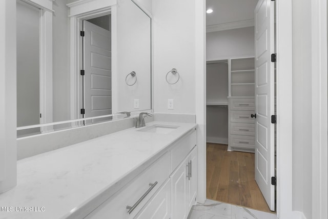 111 Grand Oak Blvd, Clinton, MS 39056 - bathroom featuring vanity, crown molding, marble look tile flooring, and recessed lighting