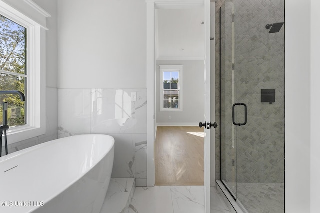 111 Grand Oak Blvd, Clinton, MS 39056 - bathroom featuring a freestanding tub, marble tiled flooring, and a shower stall