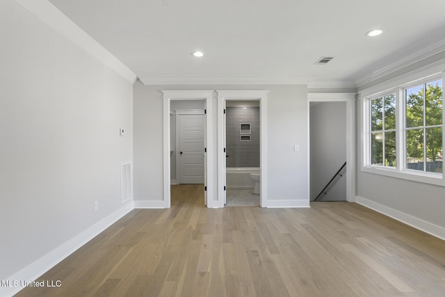 111 Grand Oak Blvd, Clinton, MS 39056 - unfurnished bedroom featuring crown molding, light wood-style flooring, recessed lighting, baseboards, and connected bathroom