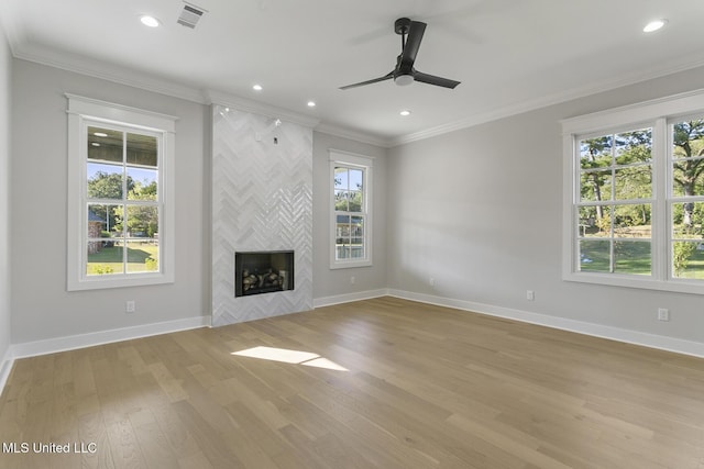 111 Grand Oak Blvd, Clinton, MS 39056 - unfurnished living room featuring ceiling fan, baseboards, light wood-style flooring, recessed lighting, and a fireplace
