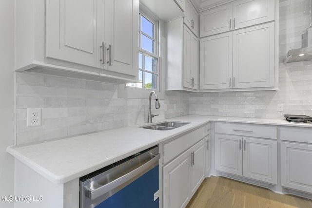111 Grand Oak Blvd, Clinton, MS 39056 - kitchen featuring stainless steel dishwasher, a sink, light countertops, and backsplash