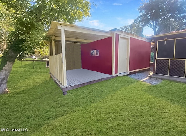 view of outdoor structure with a yard