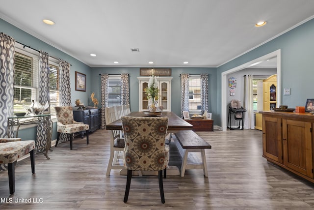 56 53rd St, Gulfport, MS 39507 - dining space with crown molding, recessed lighting, and wood finished floors