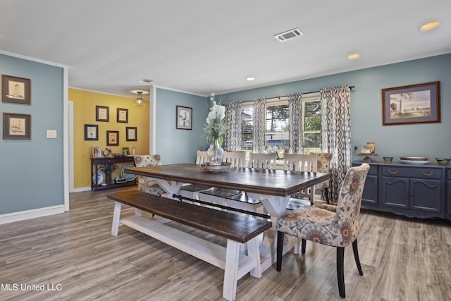 56 53rd St, Gulfport, MS 39507 - dining space featuring crown molding, light wood-style flooring, and recessed lighting