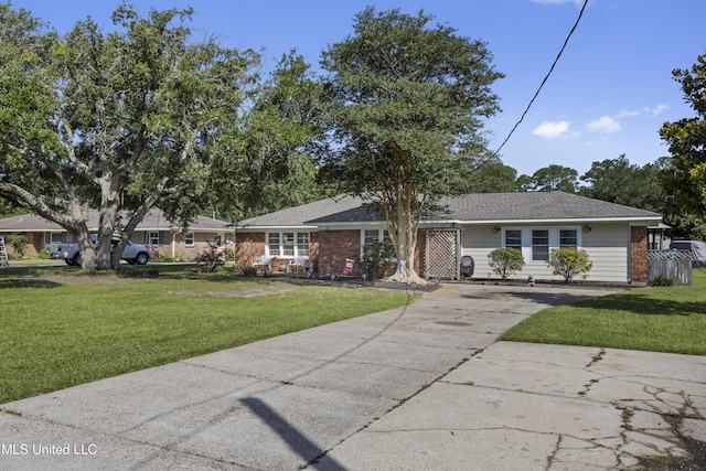 56 53rd St, Gulfport, MS 39507 - single story home featuring driveway, brick siding, a front yard, and a shingled roof