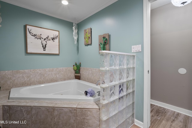 56 53rd St, Gulfport, MS 39507 - full bathroom with a tub with jets, crown molding, and wood finished floors