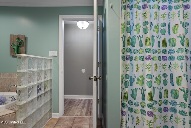 56 53rd St, Gulfport, MS 39507 - bathroom with a garden tub, curtained shower, tile patterned flooring, and crown molding
