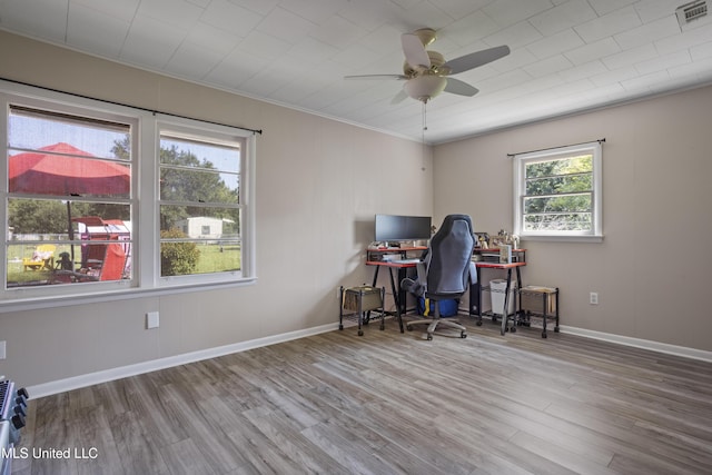 56 53rd St, Gulfport, MS 39507 - home office with wood finished floors, ceiling fan, and ornamental molding