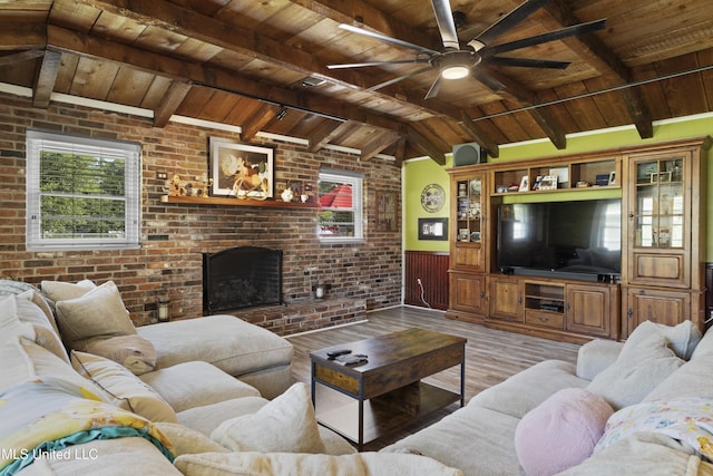 56 53rd St, Gulfport, MS 39507 - living area with wood ceiling, light wood finished floors, wainscoting, a ceiling fan, and a fireplace