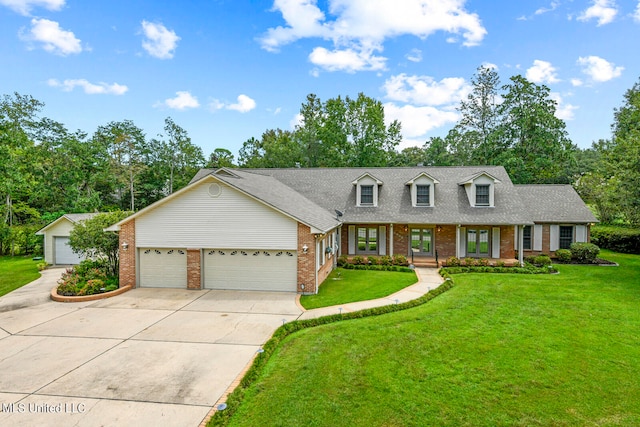 view of front of property featuring a garage, brick siding, and a front lawn