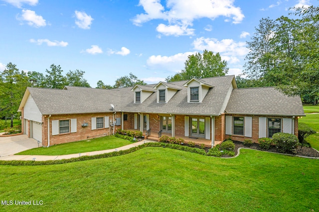 cape cod-style house featuring a front yard, a garage, brick siding, and roof with shingles