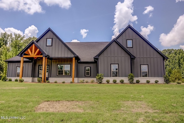 modern inspired farmhouse featuring board and batten siding, a front yard, and roof with shingles