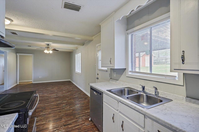 kitchen with a sink, visible vents, white cabinetry, light countertops, and appliances with stainless steel finishes