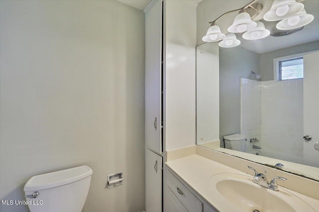 bathroom with  shower combination, vanity, and toilet