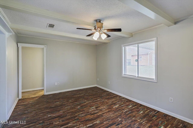 spare room with a textured ceiling, ceiling fan, beamed ceiling, and wood finished floors