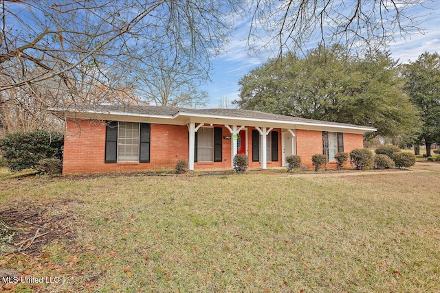 ranch-style home with a front lawn and brick siding