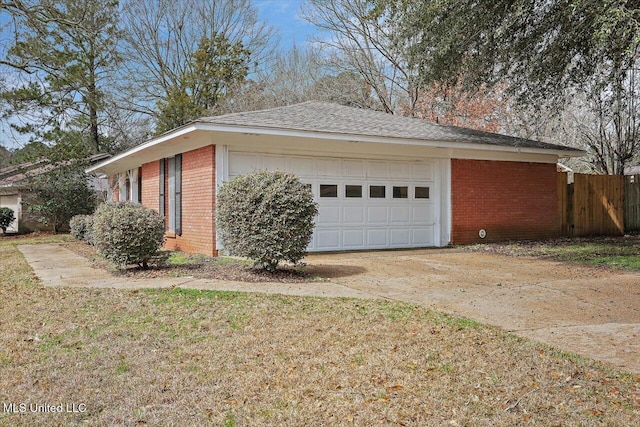 view of home's exterior featuring concrete driveway, brick siding, and an attached garage